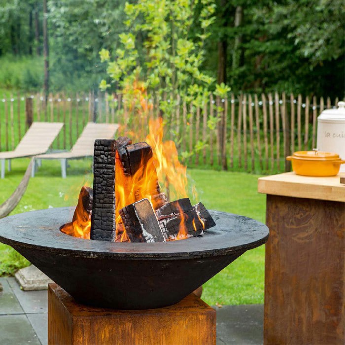 A lit weathering steel grill