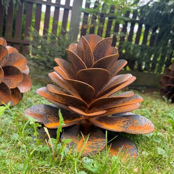 rusty metal pine cone sculpture