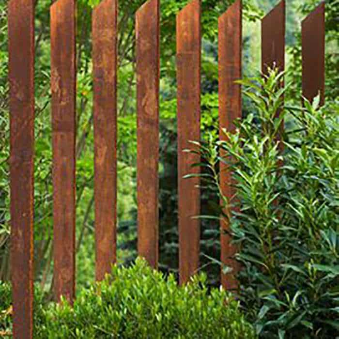 Garden Rusty metal picket fence