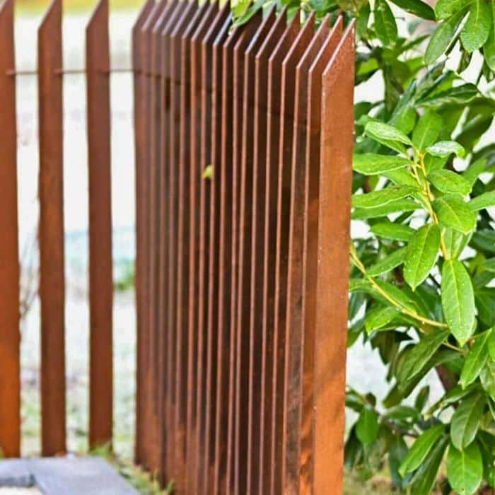 Garden Rusty metal picket fence